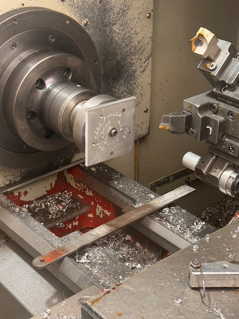 Quick Crank Pork Puller being machined on a lathe
